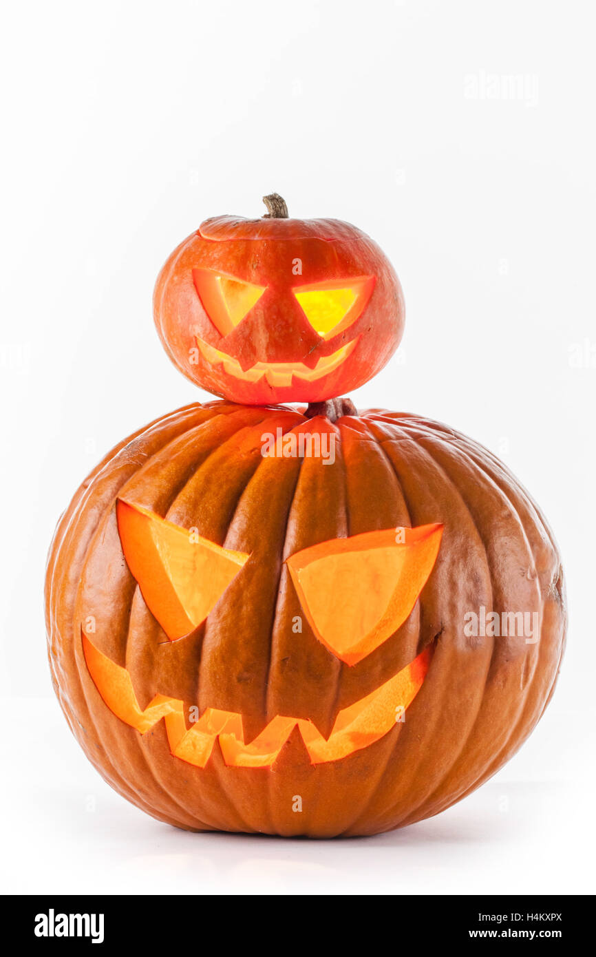 Glowing Halloween pumpkins isolated on white background Stock Photo - Alamy
