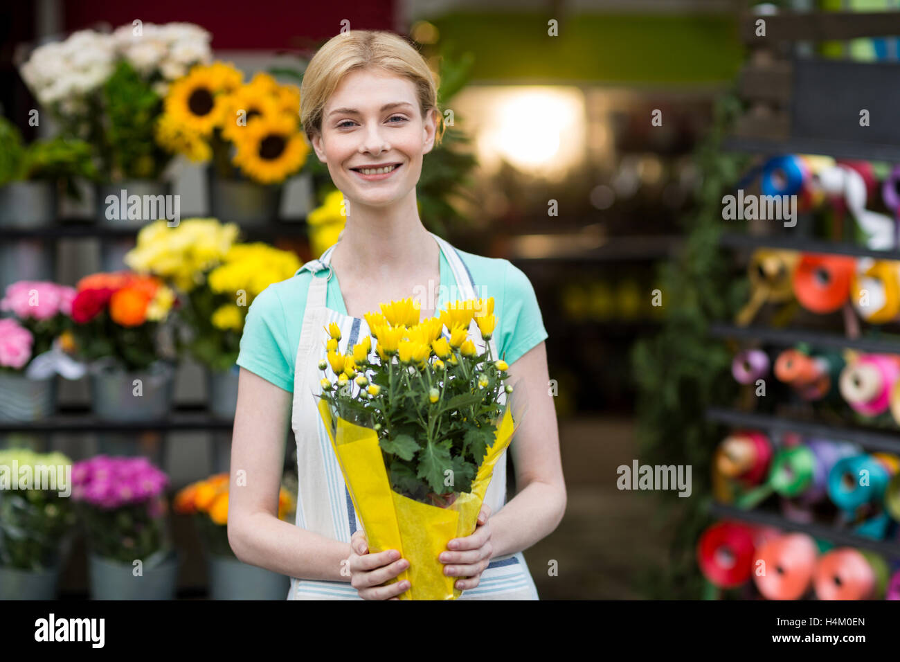 Female florist holding bouquet of flower Stock Photo - Alamy