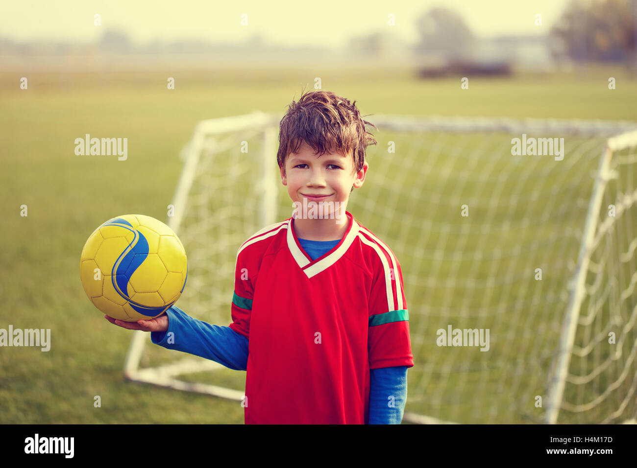 Little funny boy on football hi-res stock photography and images - Alamy