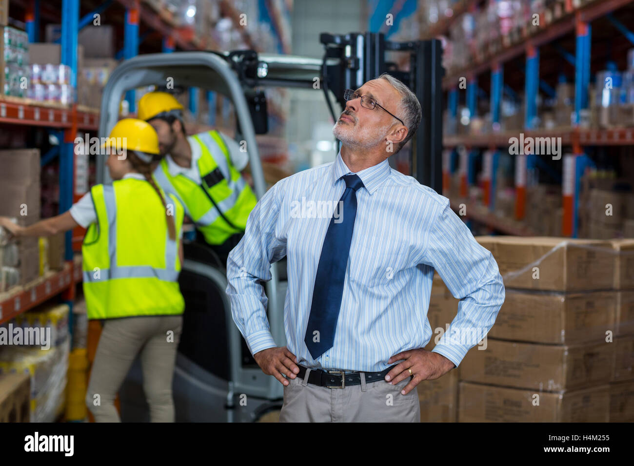 Warehouse manager standing with hands on hips Stock Photo