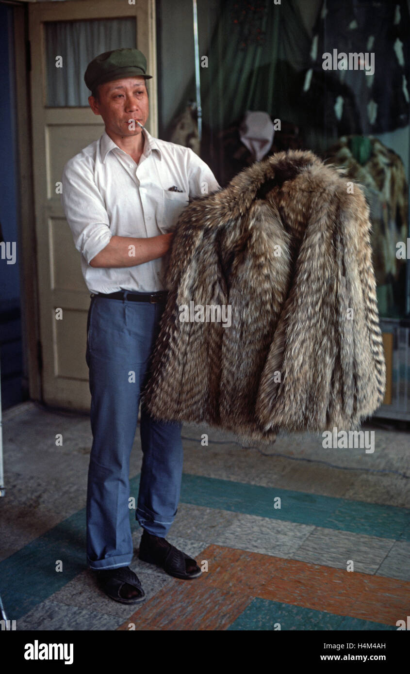 Owner of Harbin Fur Factory holding fur coat made from endangered animal  skin, Heliongjiang Province, China Stock Photo - Alamy