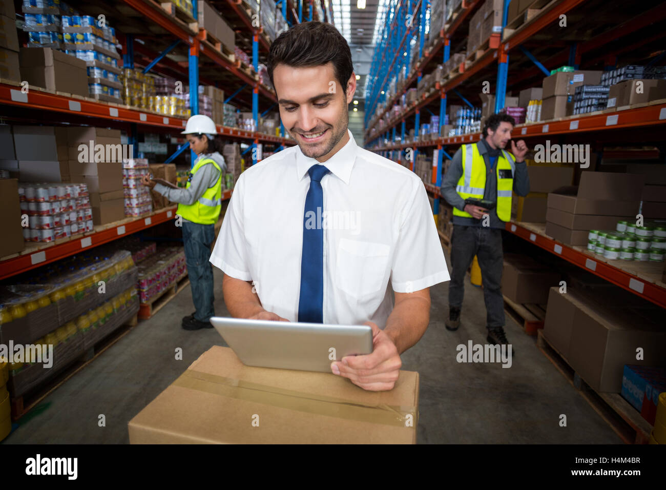 Warehouse manager using digital tablet Stock Photo
