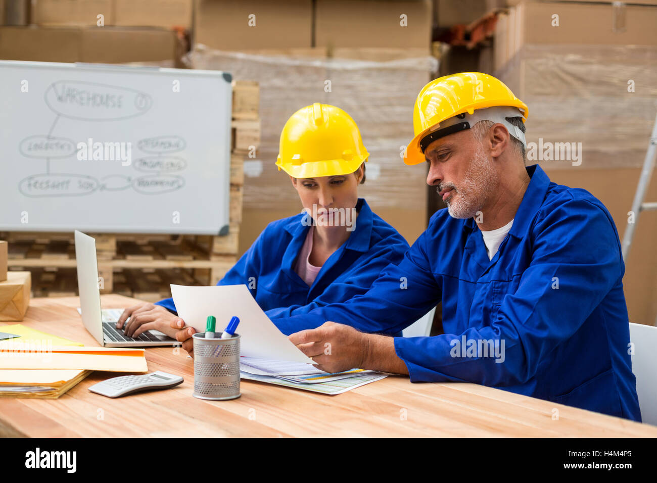 Warehouse workers discussing with each other Stock Photo Alamy