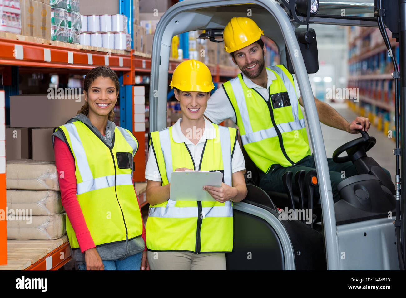 Male and female workers smiling together Stock Photo