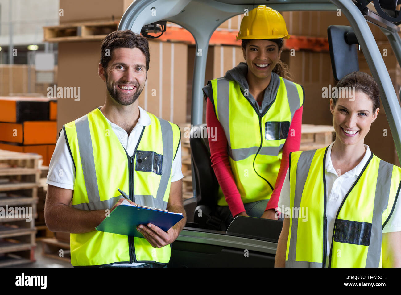 Portrait Of Warehouse Workers And Forklift Driver Stock Photo Alamy