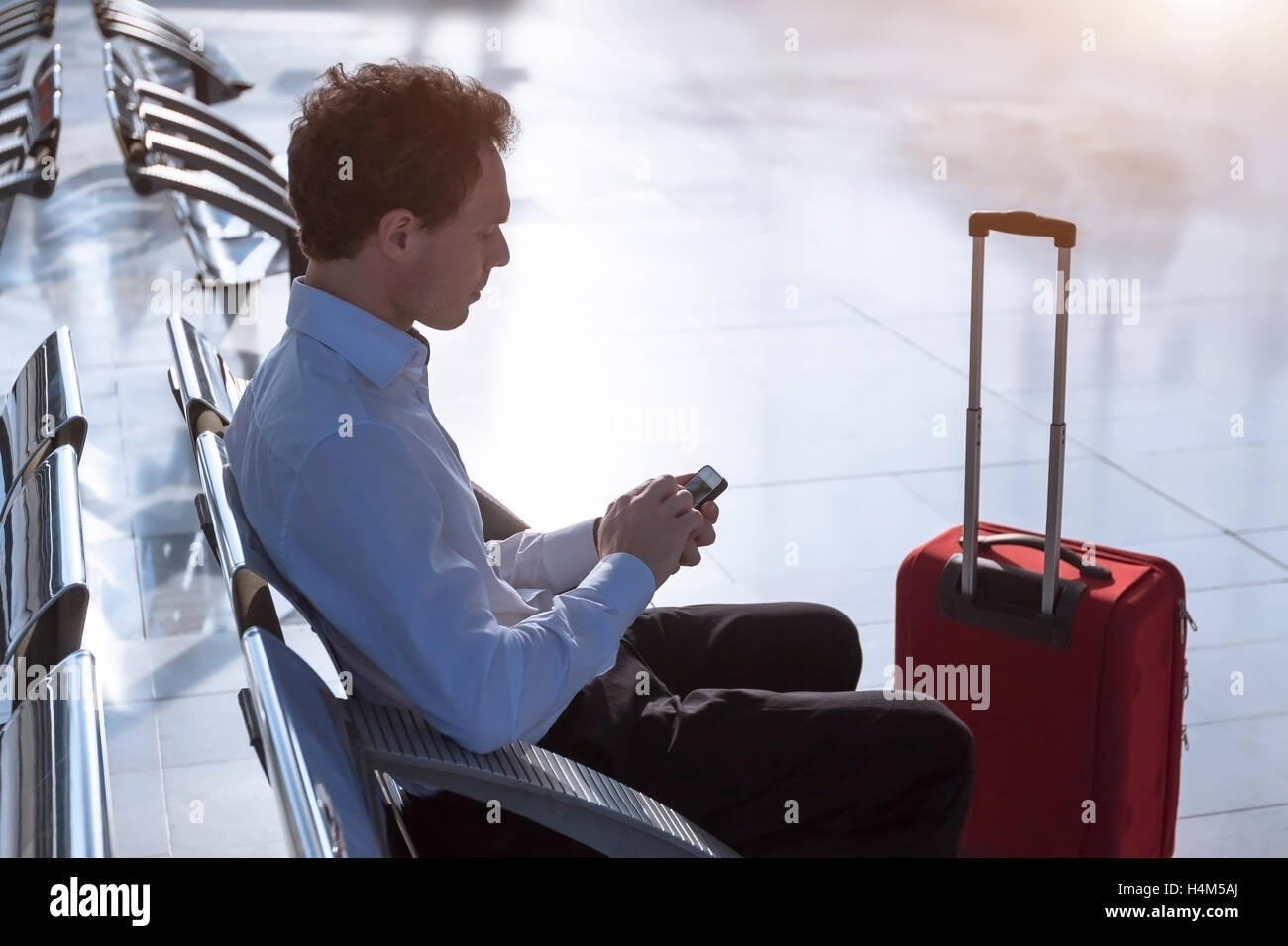 Using wireless internet at airport Stock Photo