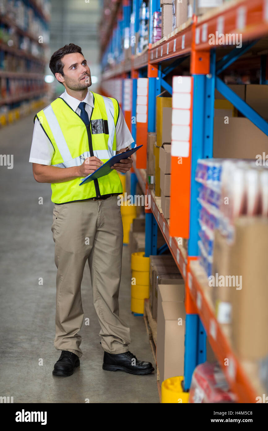Warehouse manager looking at packages Stock Photo