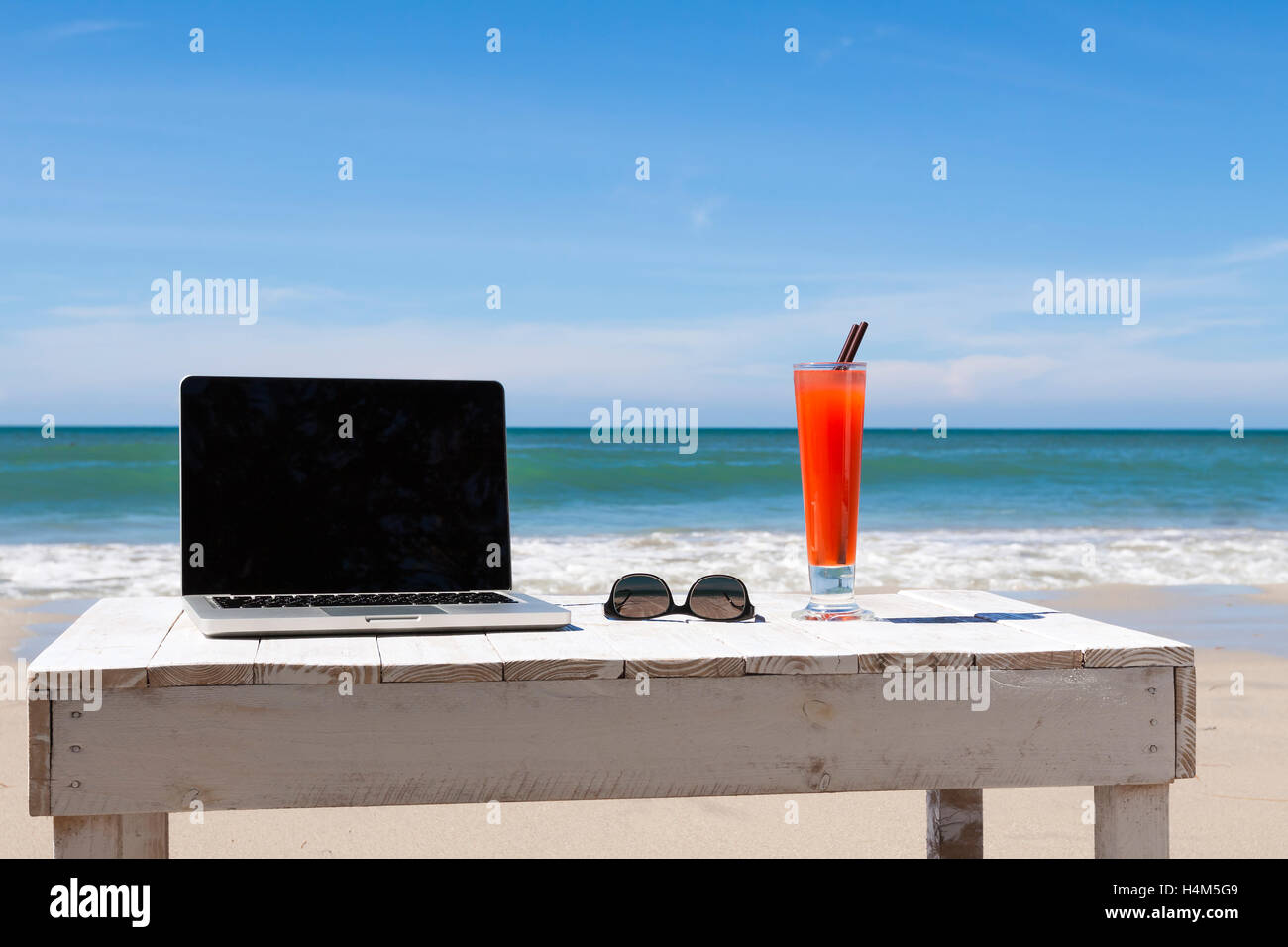 Working on the beach Stock Photo - Alamy