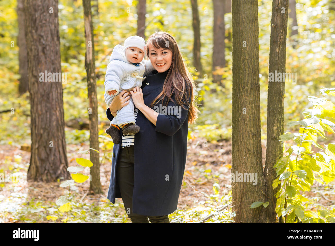 Mother and baby daughter in the autumn park Stock Photo - Alamy