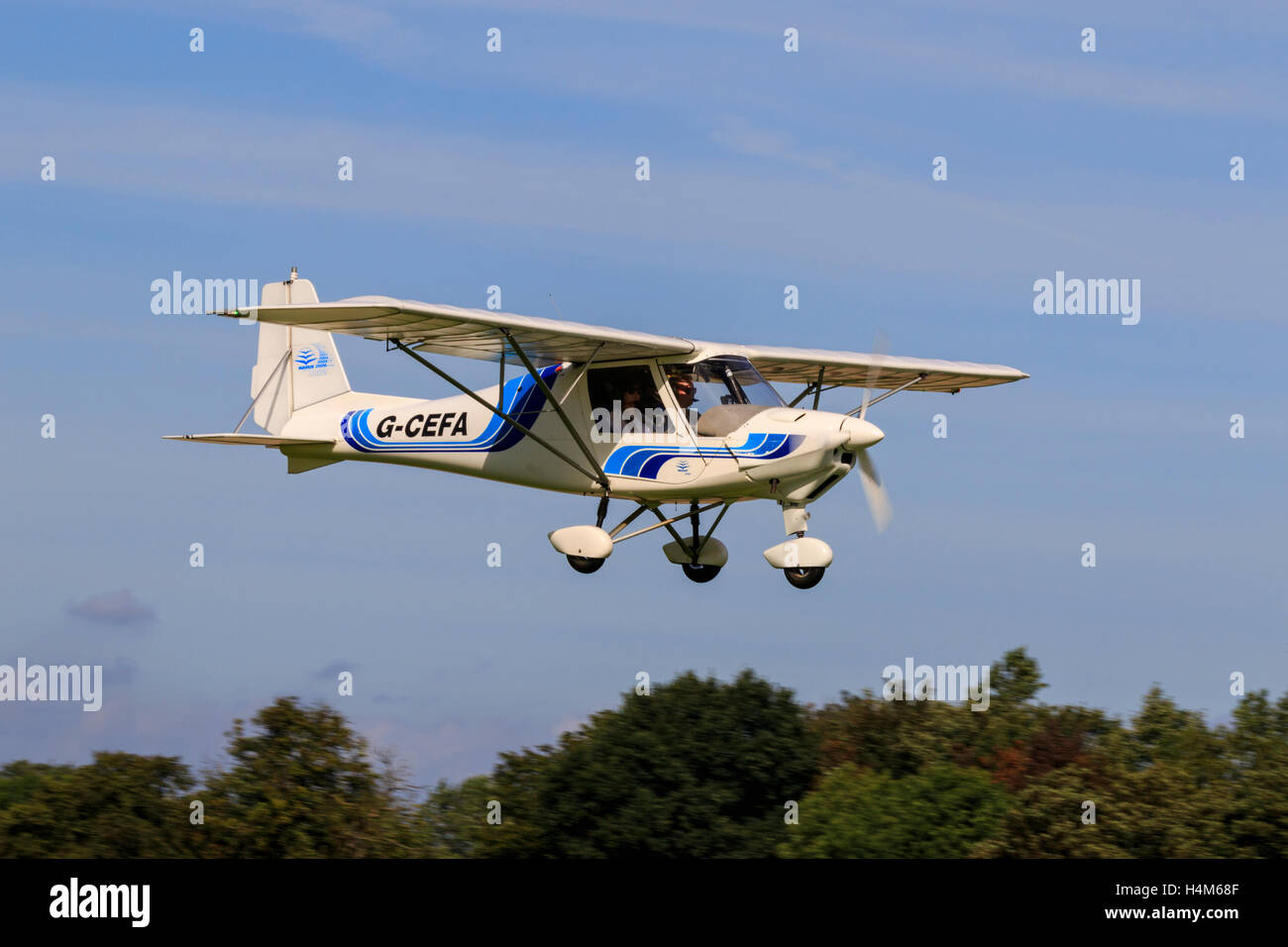 Ikarus C42 FB UK G-CEFA in flight landing at Breighton Airfield Stock Photo