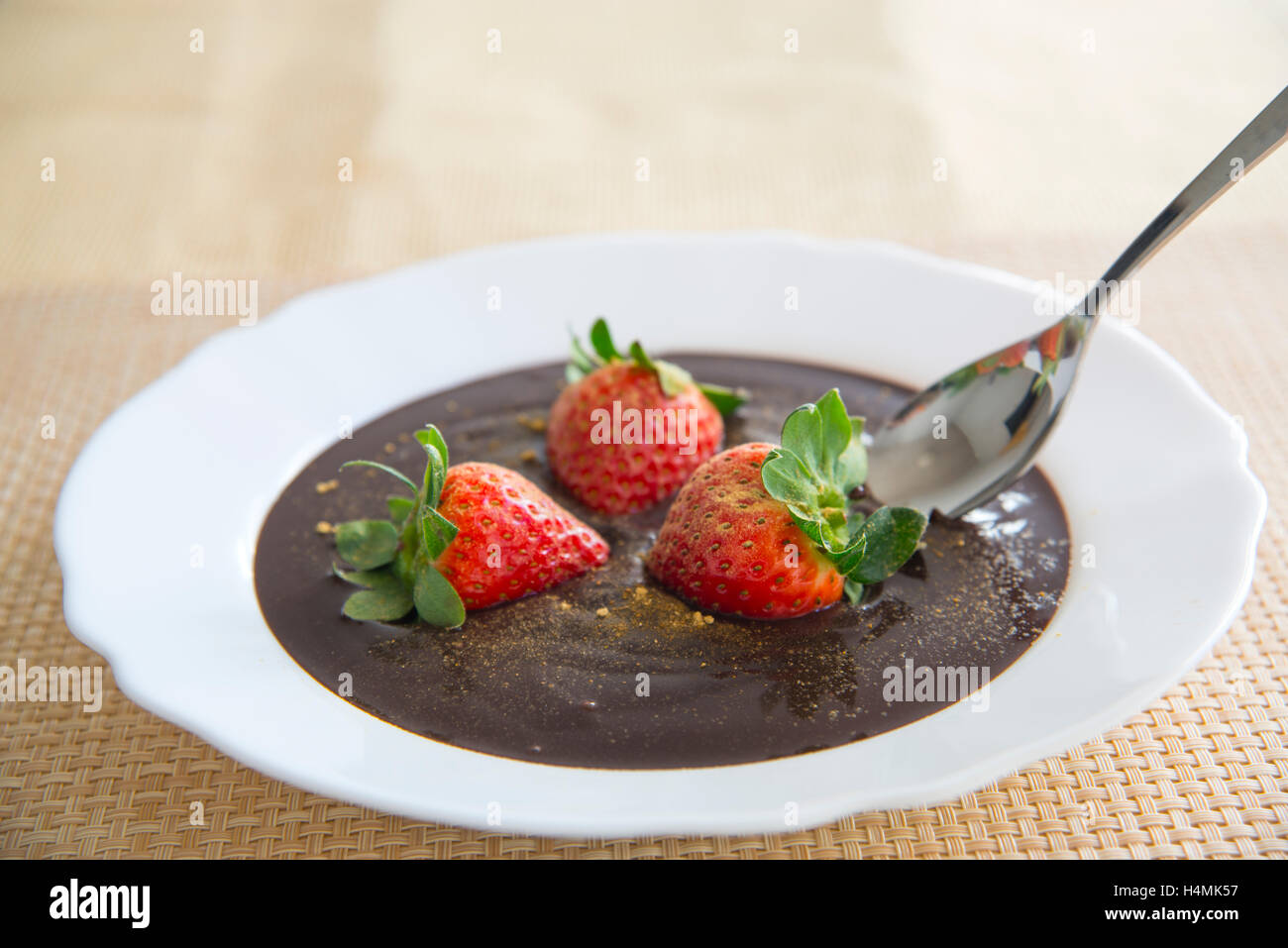 Chocolate cream with strawberries and ginger. Close view. Stock Photo
