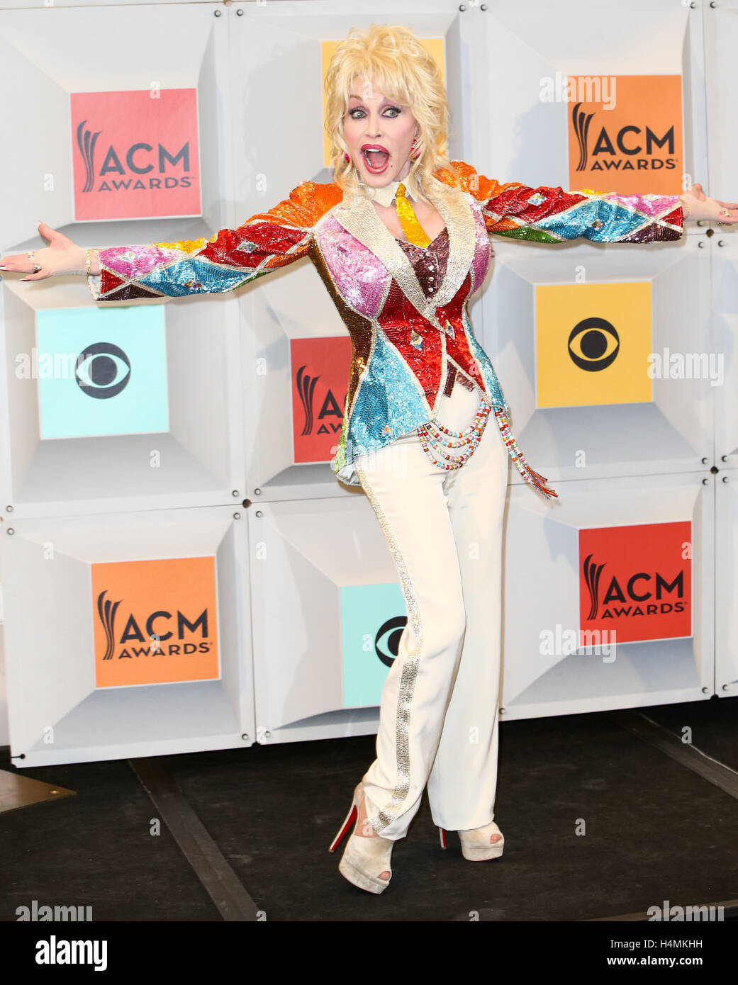 Singer-songwriter and producer Dolly Parton, winner of the Tex Ritter Award for 'Dolly Parton's Coat of Many Colors,' poses in the press room during the 51st Academy of Country Music Awards at MGM Grand Garden Arena on April 3, 2016 in Las Vegas, Nevada. Stock Photo