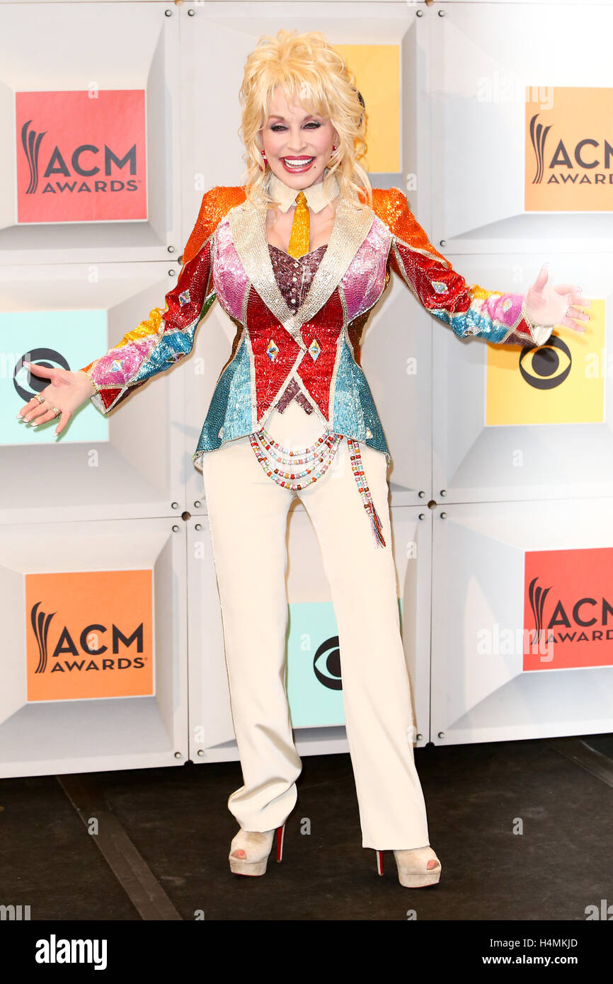 Singer-songwriter and producer Dolly Parton, winner of the Tex Ritter Award for 'Dolly Parton's Coat of Many Colors,' poses in the press room during the 51st Academy of Country Music Awards at MGM Grand Garden Arena on April 3, 2016 in Las Vegas, Nevada. Stock Photo