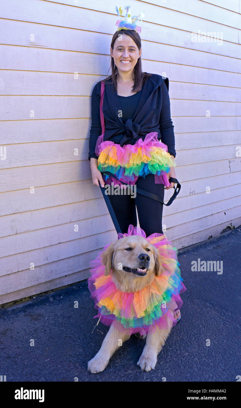 A woman & her golden retriever in matching costumes in Coney Island at the Halloween Harvest Dog Parade and costume contest. Stock Photo