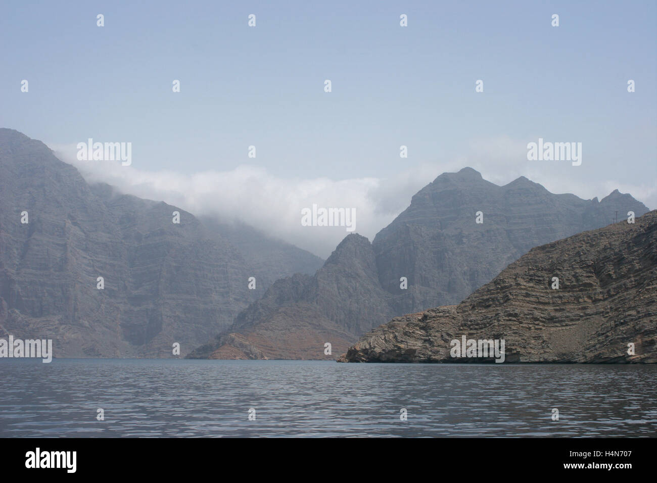 The wild landscape and cliffs of the Musandam Peninsular in northern Oman viewed from the Gulf of Oman Stock Photo