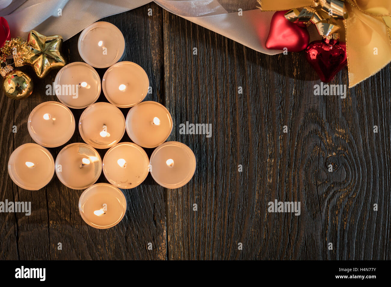 christmas xmas tree candles wood background Stock Photo