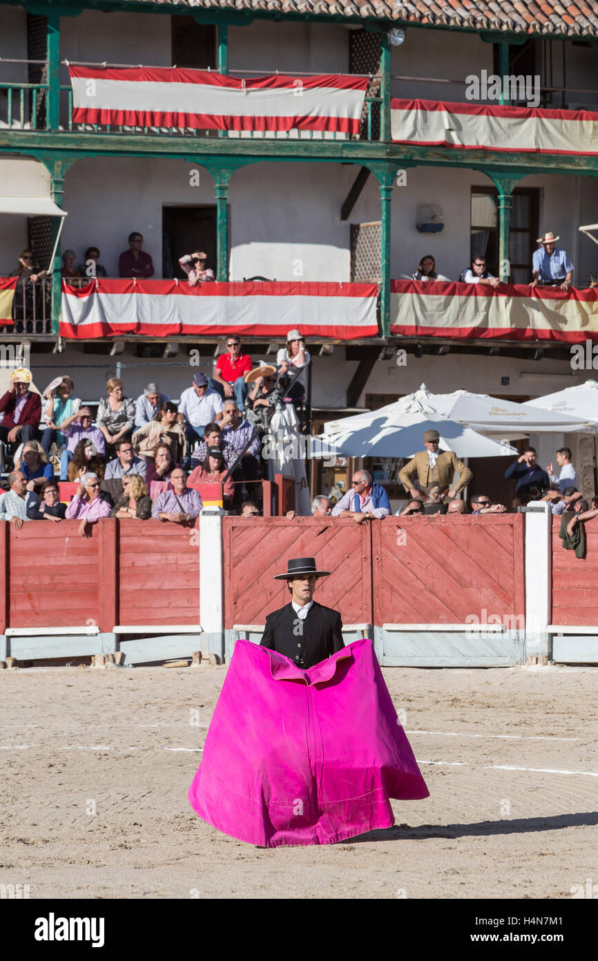 Spanish bullfighter Miguel Abellan with the cape in the main square of chinchon, Spain Stock Photo