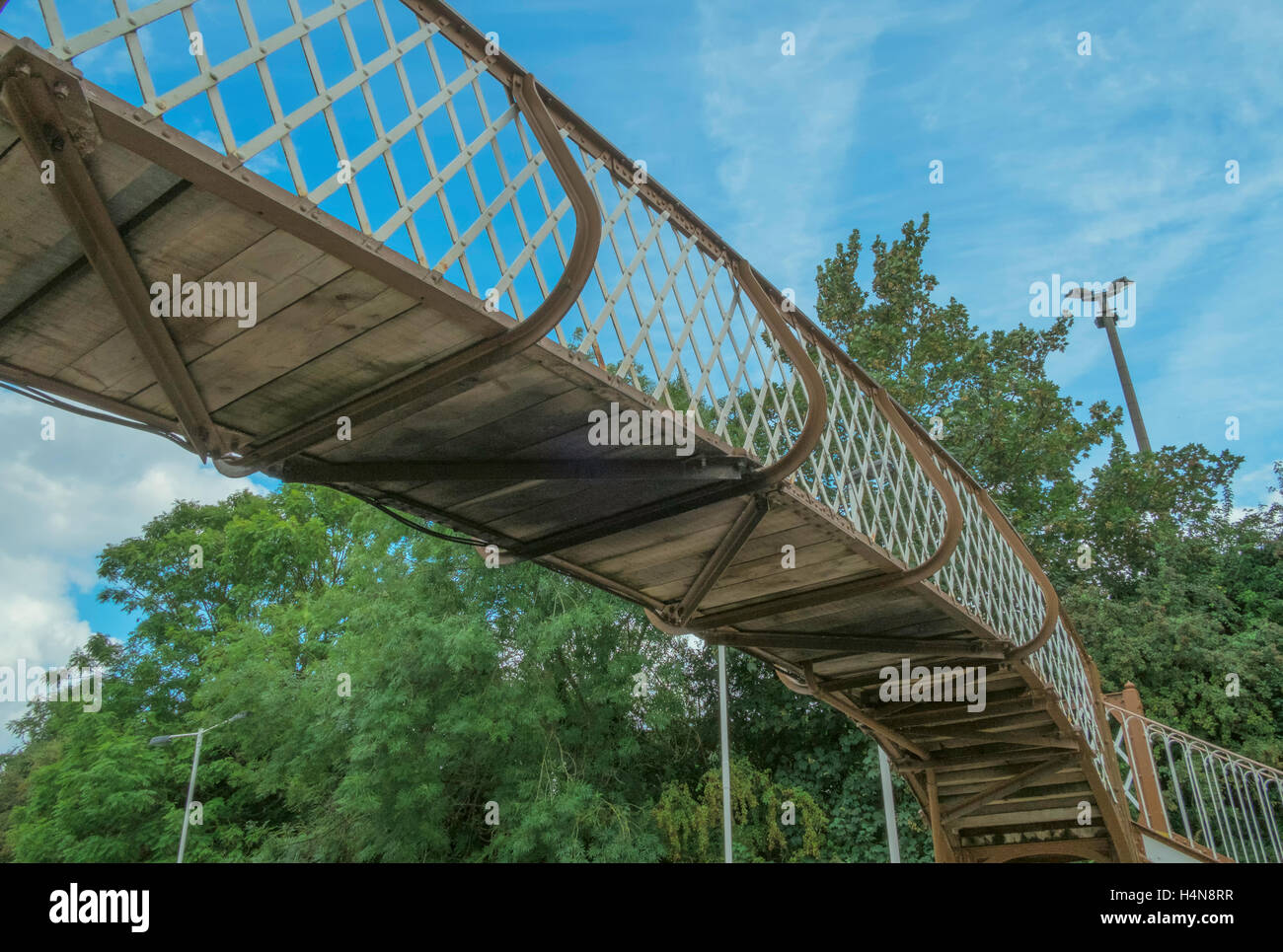 Curved Railway footbridge over the lines Stock Photo Alamy