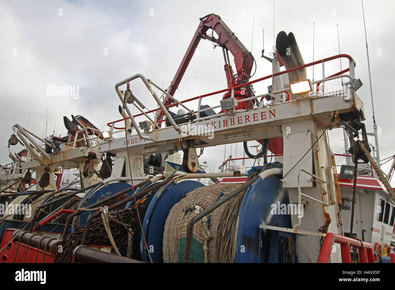 Trawlers and winching gear at stern of boats hires stock photography