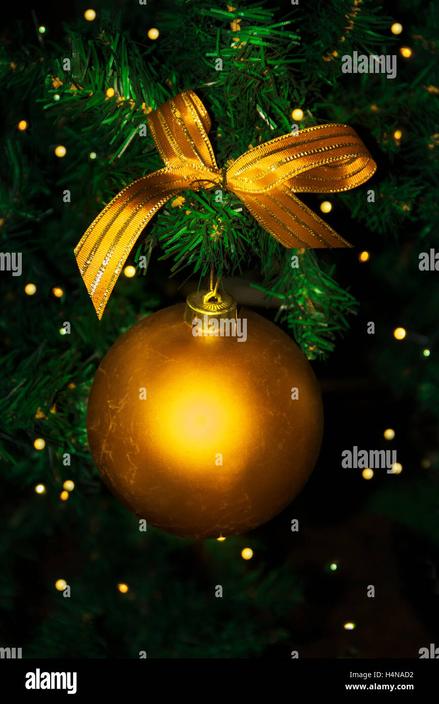 Golden Christmas ornament hanging. Christmas tree and Christmas decoration. Stock Photo
