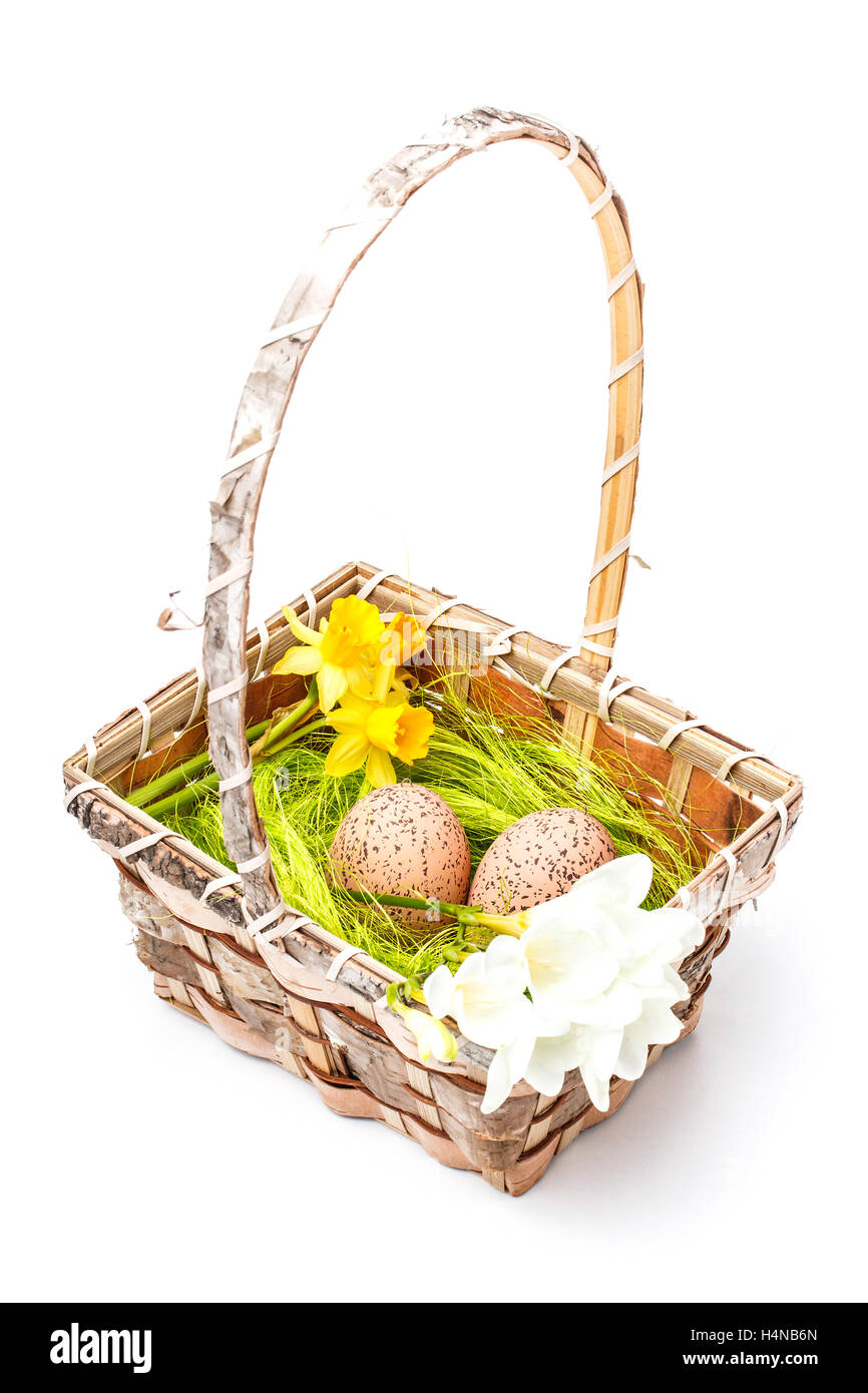 Easter eggs in basket isolated on white Stock Photo - Alamy
