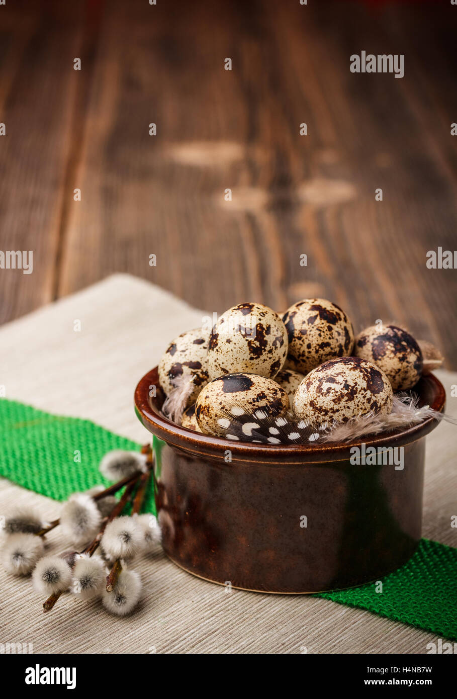 Easter still life of quail eggs and willow branches Stock Photo