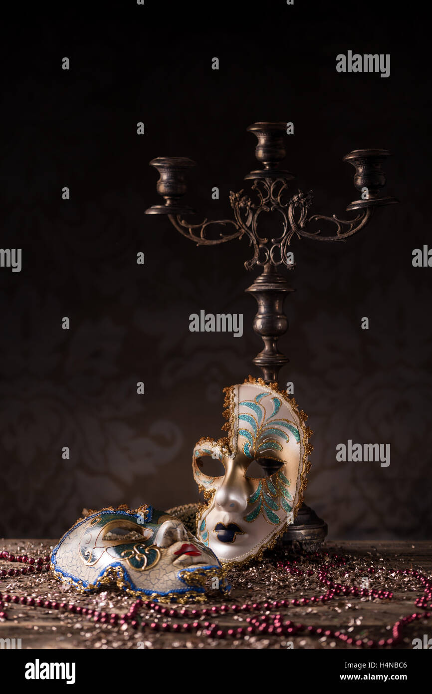 Carnival mask with candlestick and necklace Stock Photo