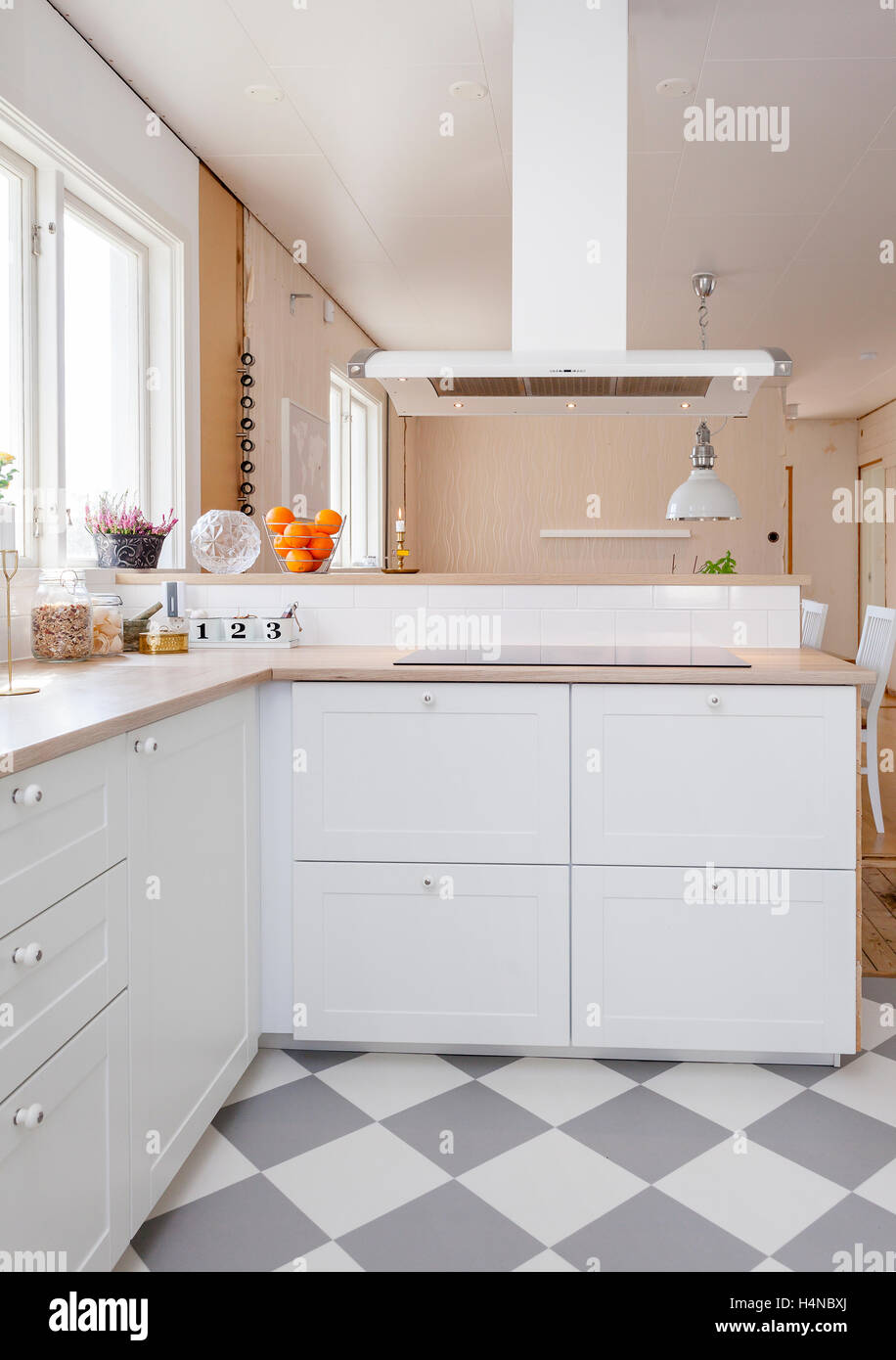 stylish clean kitchen interior with checkered floor Stock Photo