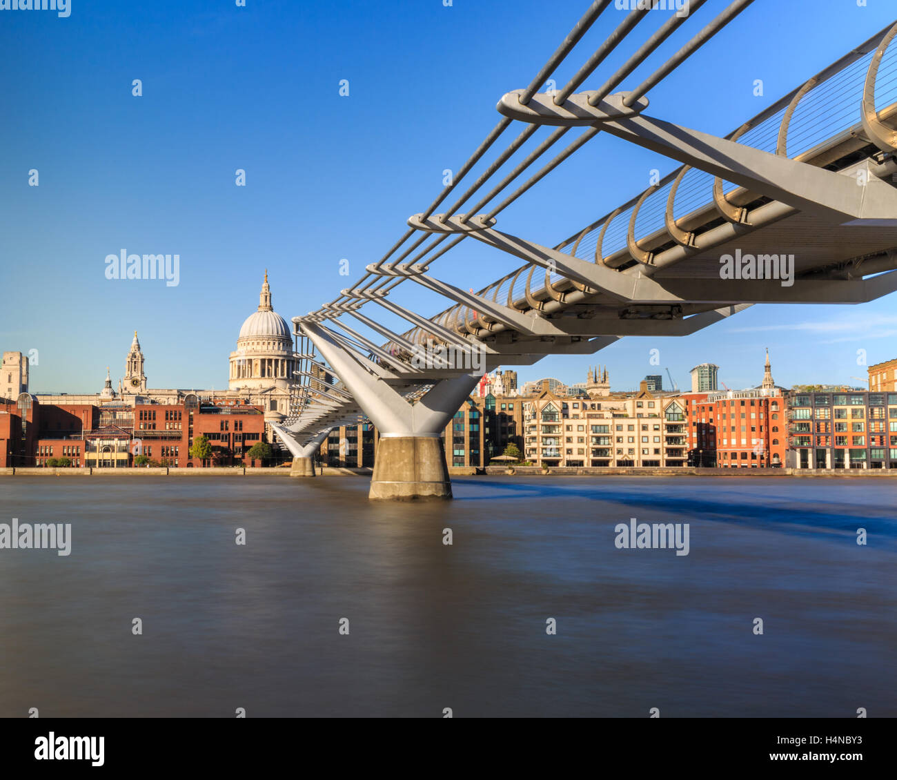 St Paul's Cathedral and Millennium Foot Bridge across the River Thames, long exposure, London, England Stock Photo
