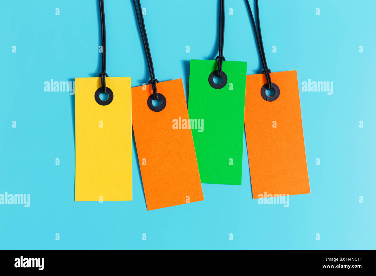 Blank paper price tag on blue background Stock Photo Alamy