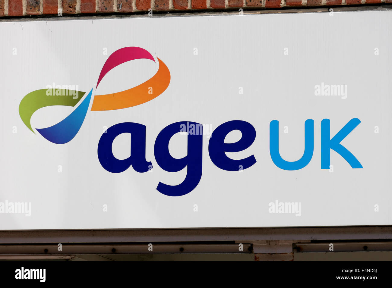 Age UK charity shop sign, Grove Shopping Centre, Witham, Essex, England Stock Photo