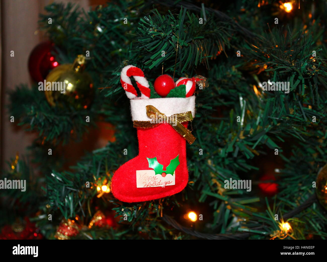 Christmas sock decoration hanging on Christmas tree Stock Photo