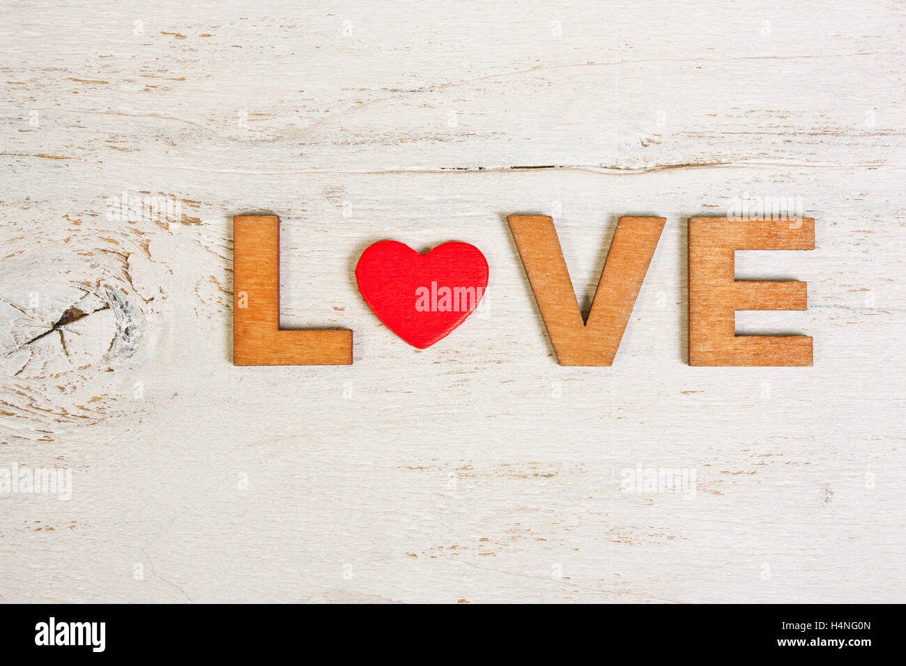 word love in wooden letters on a white background old wooden Stock Photo