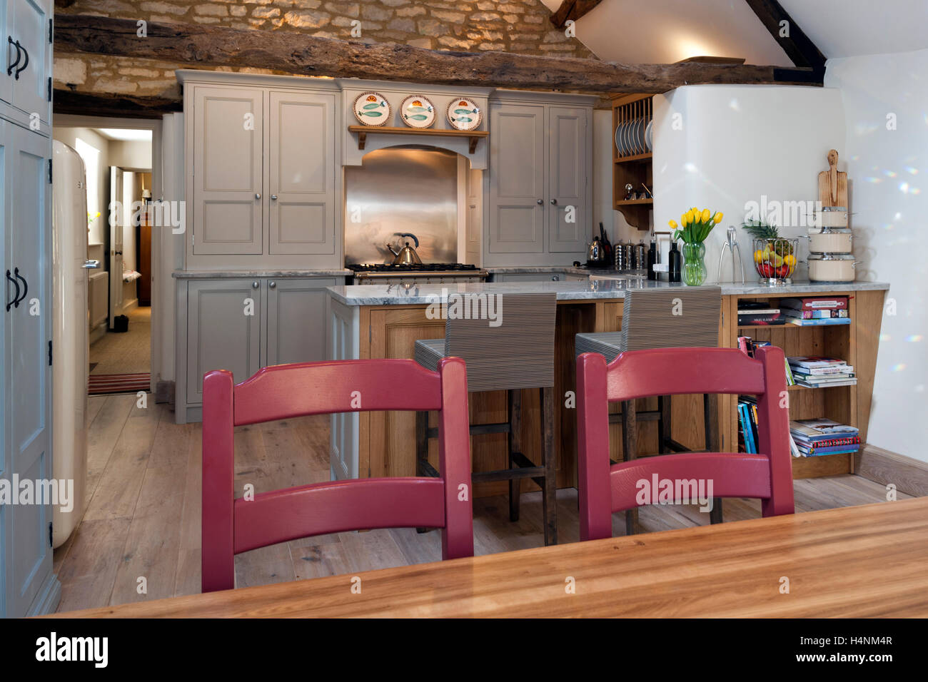 A new fitted kitchen and breakfast bar with original period features Stock Photo