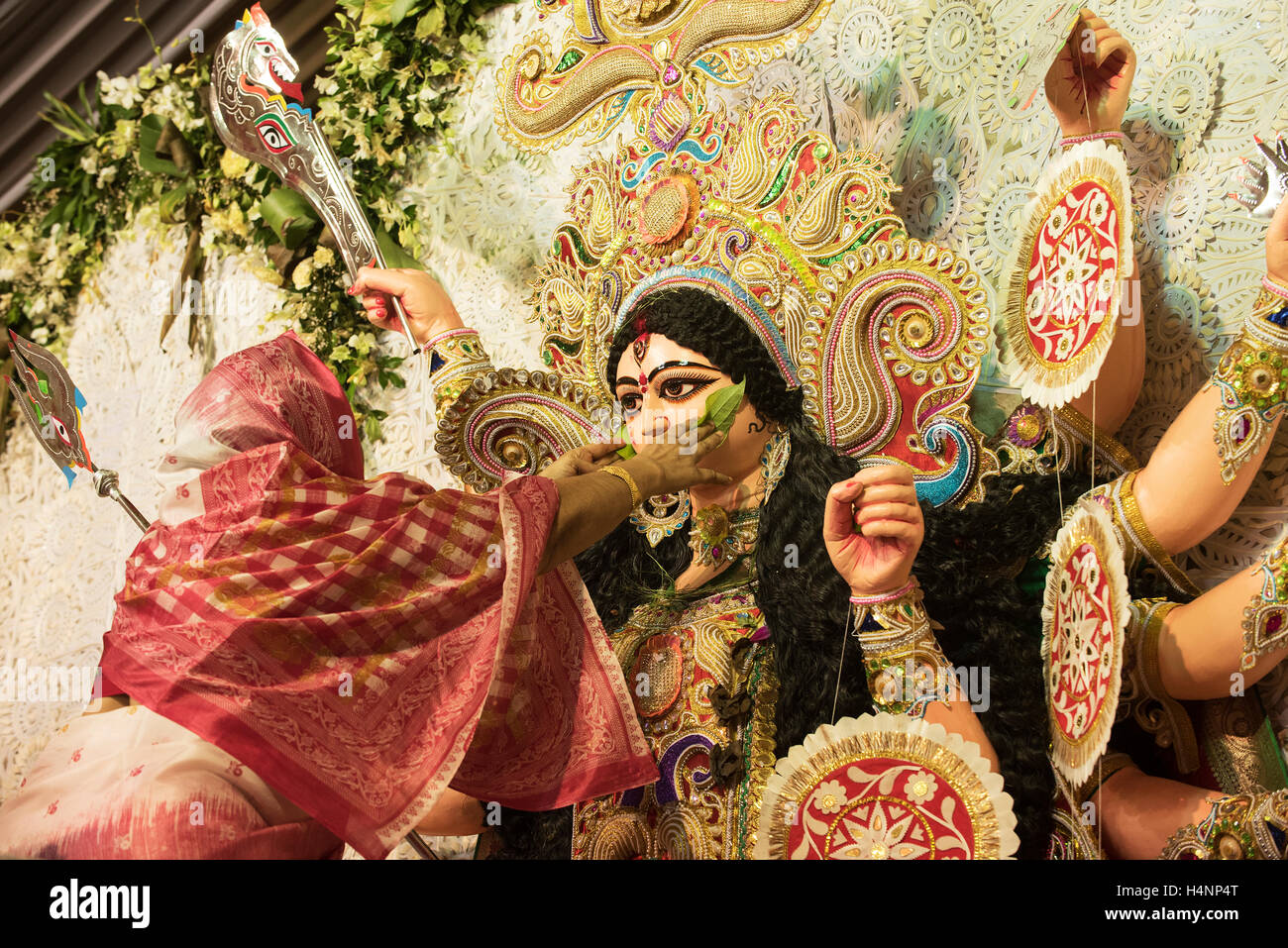 The image of Bengali Woman hindu devotee offering Godess Durga on the traditional festival of Bijoya Dasami, Dussehra, Mumbai, I Stock Photo