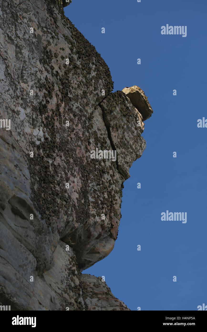 A rock positioned on edge of a cliff on the Big Pinnacle at Pilot Mountain State Park. North Carolina Stock Photo