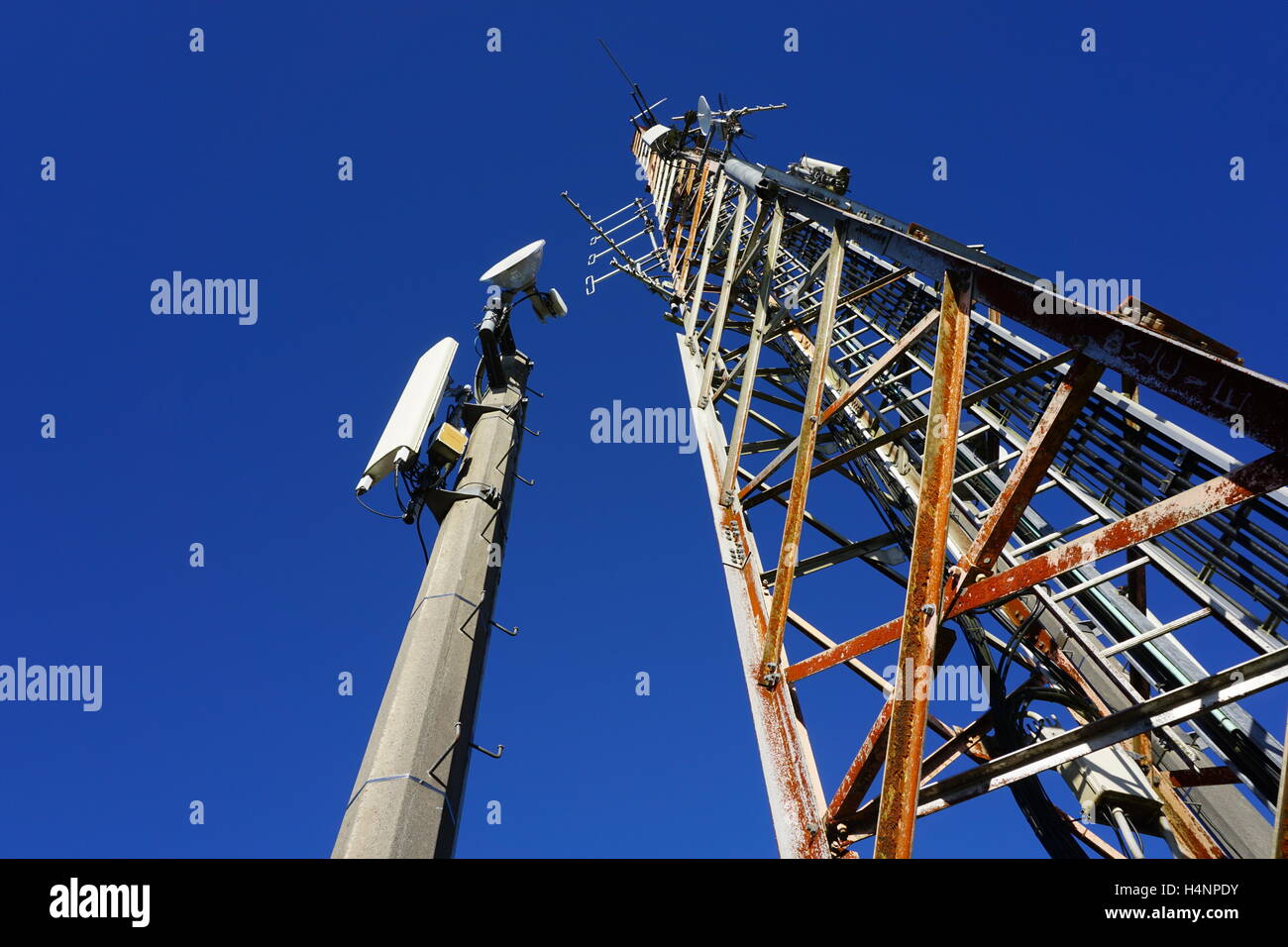 Radio transmitter towers, new & old, at Rainbow Mountain, NZ. Stock Photo