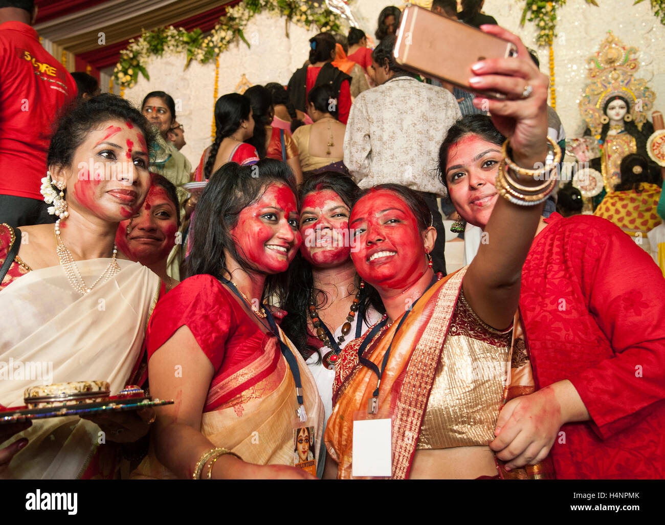 The image of Married Bengali women taking selfies at the end of festival. On the last of Durga Puja Stock Photo