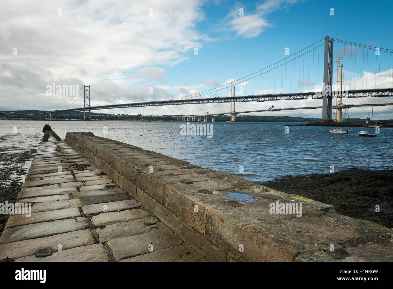 The Town Pier, Forth Road Bridge and Queensferry Crossing during construction, North Queensferry, Fife, Scotland. Stock Photo
