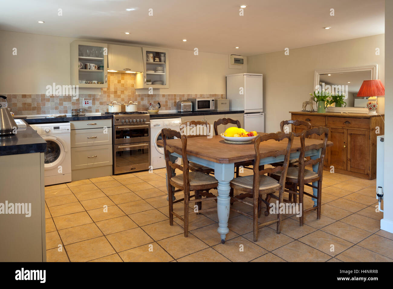 Mixed furnishing styles kitchen and dining area Stock Photo Alamy