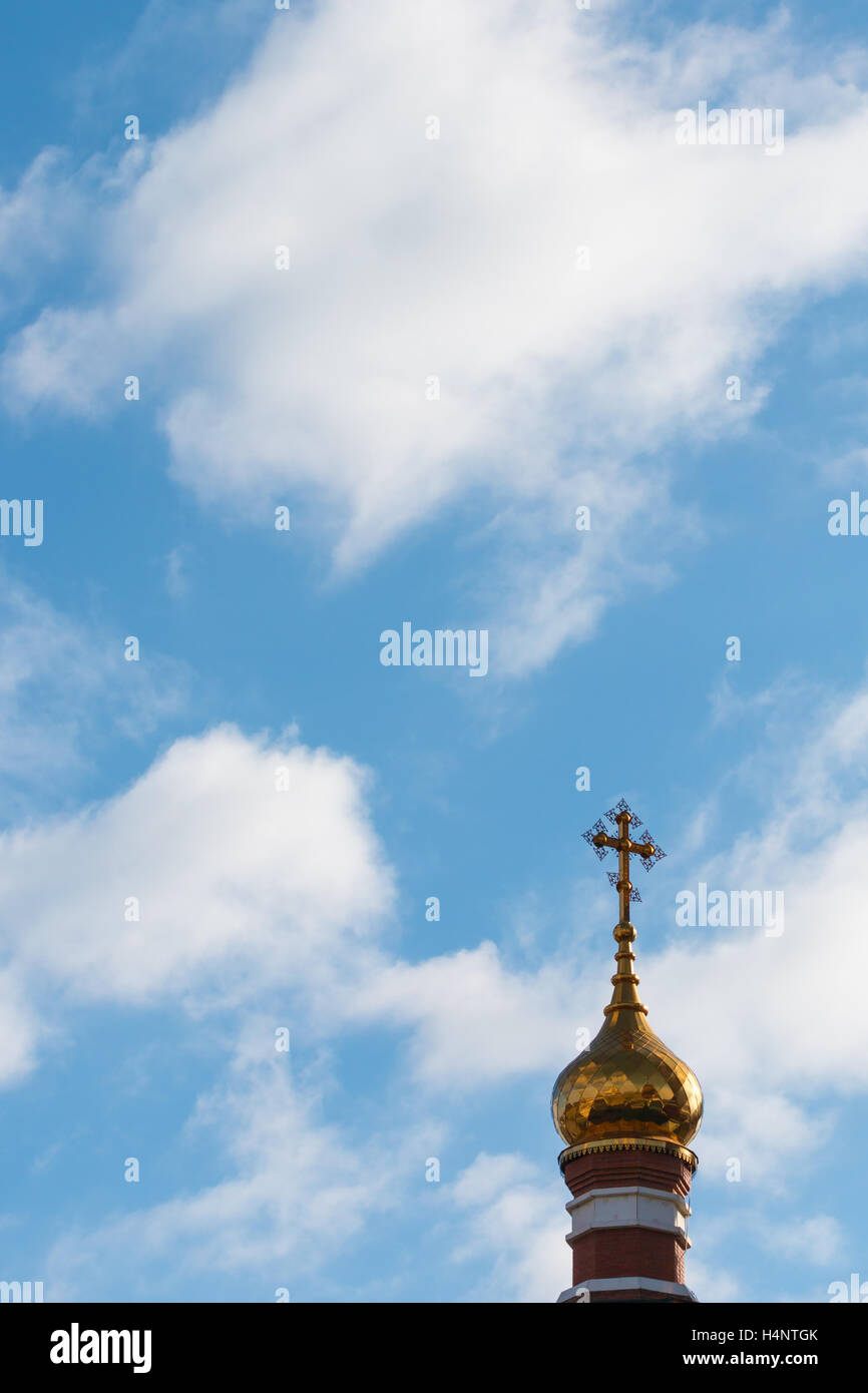 Dome of orthodox church with a cross on a background of blue sky with ...