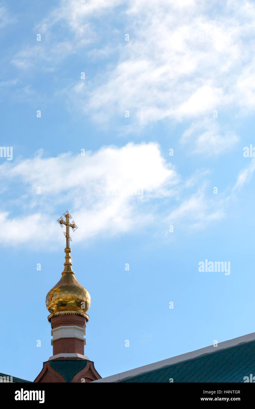 Dome of orthodox church with a cross on a background of blue sky with ...