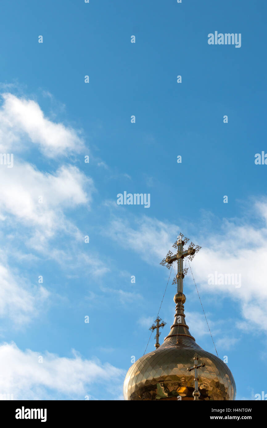 Dome of orthodox church with a cross on a background of blue sky with ...