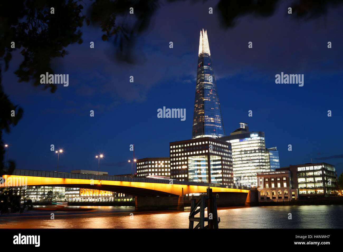 The Shard and London Bridge at night Stock Photo