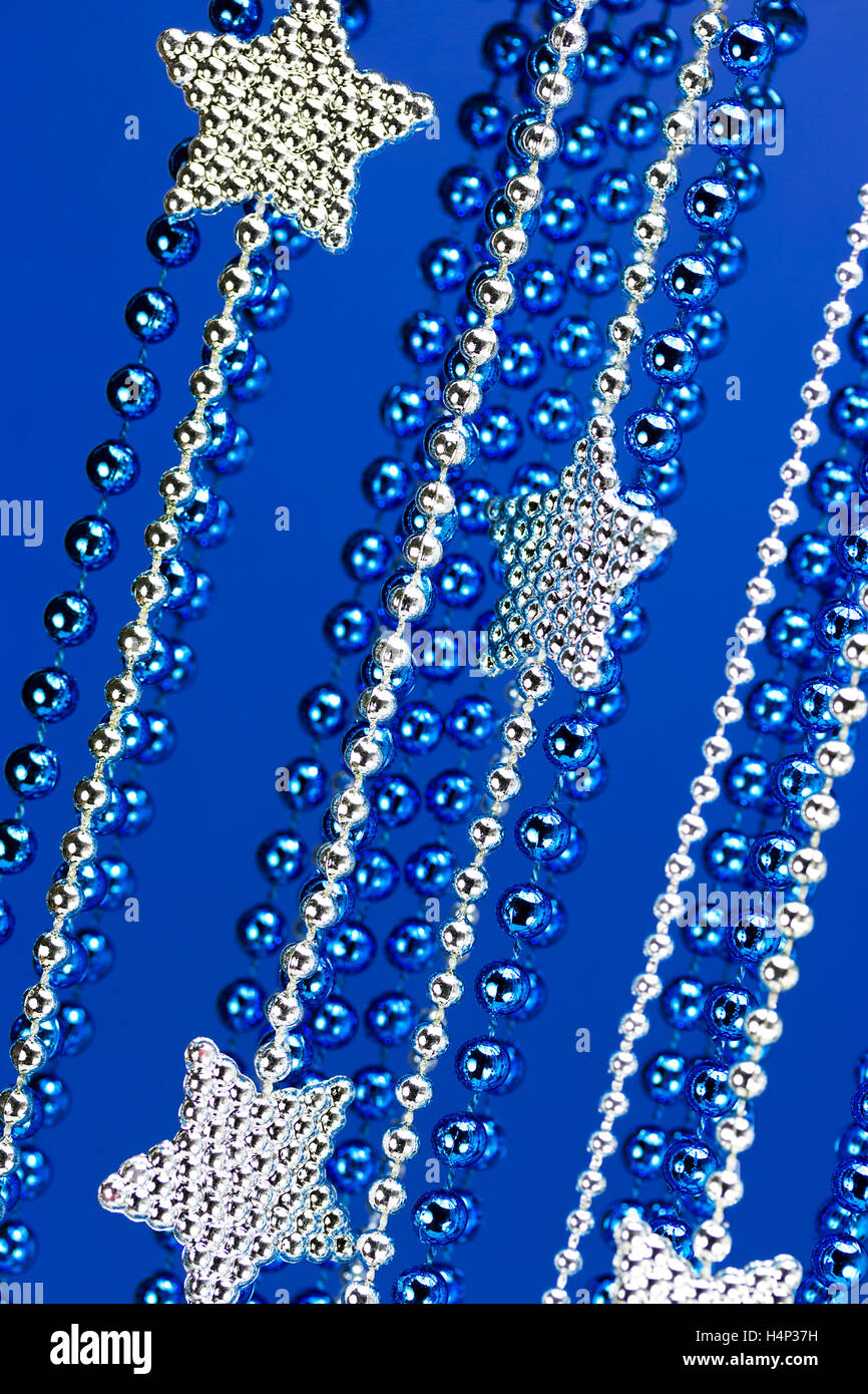 Silver Christmas stars on blue background Stock Photo - Alamy