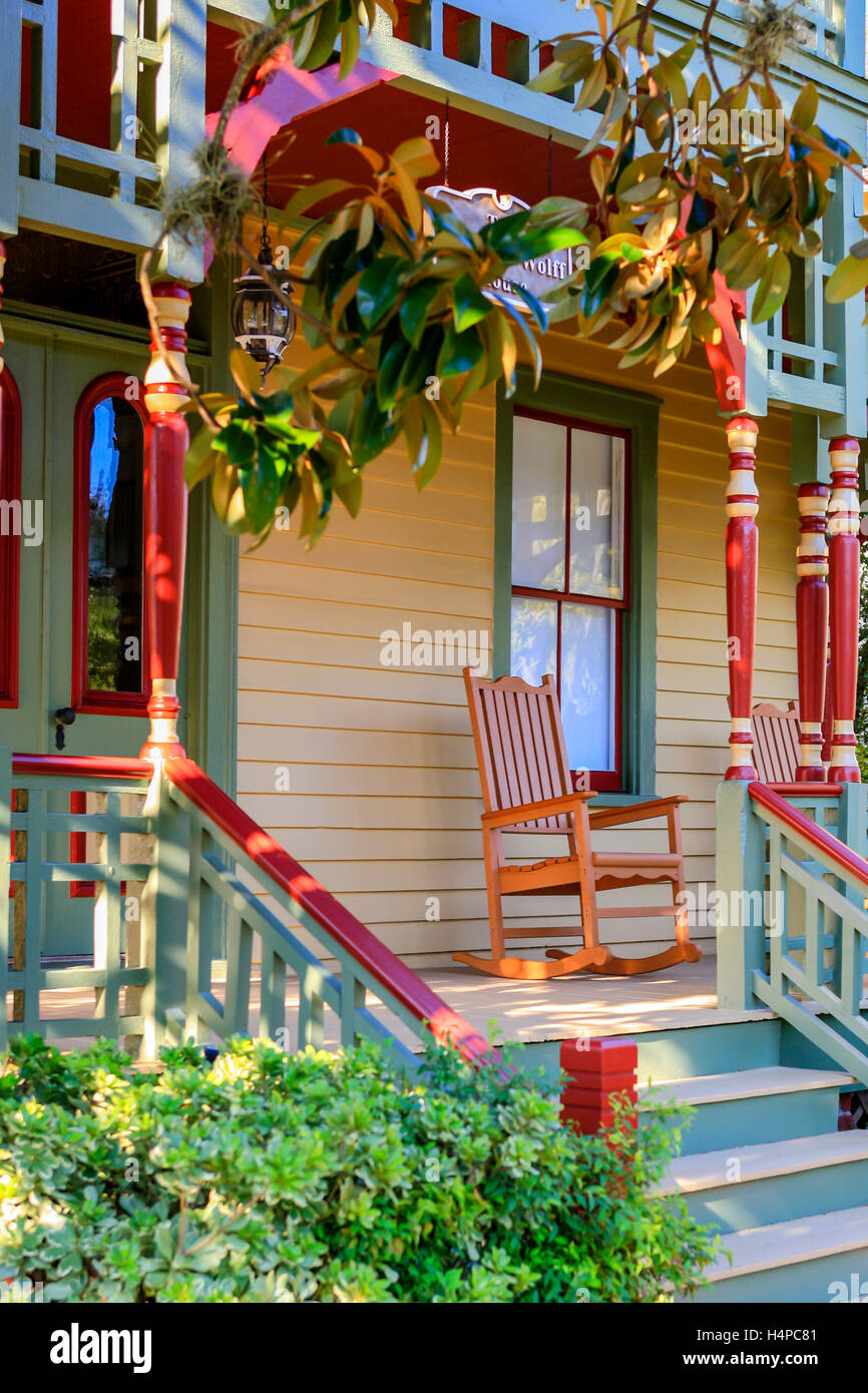 Rocking chair on the porch of this homes around Ash Streets in the historic district of Fernandina Beach City in Florida Stock Photo