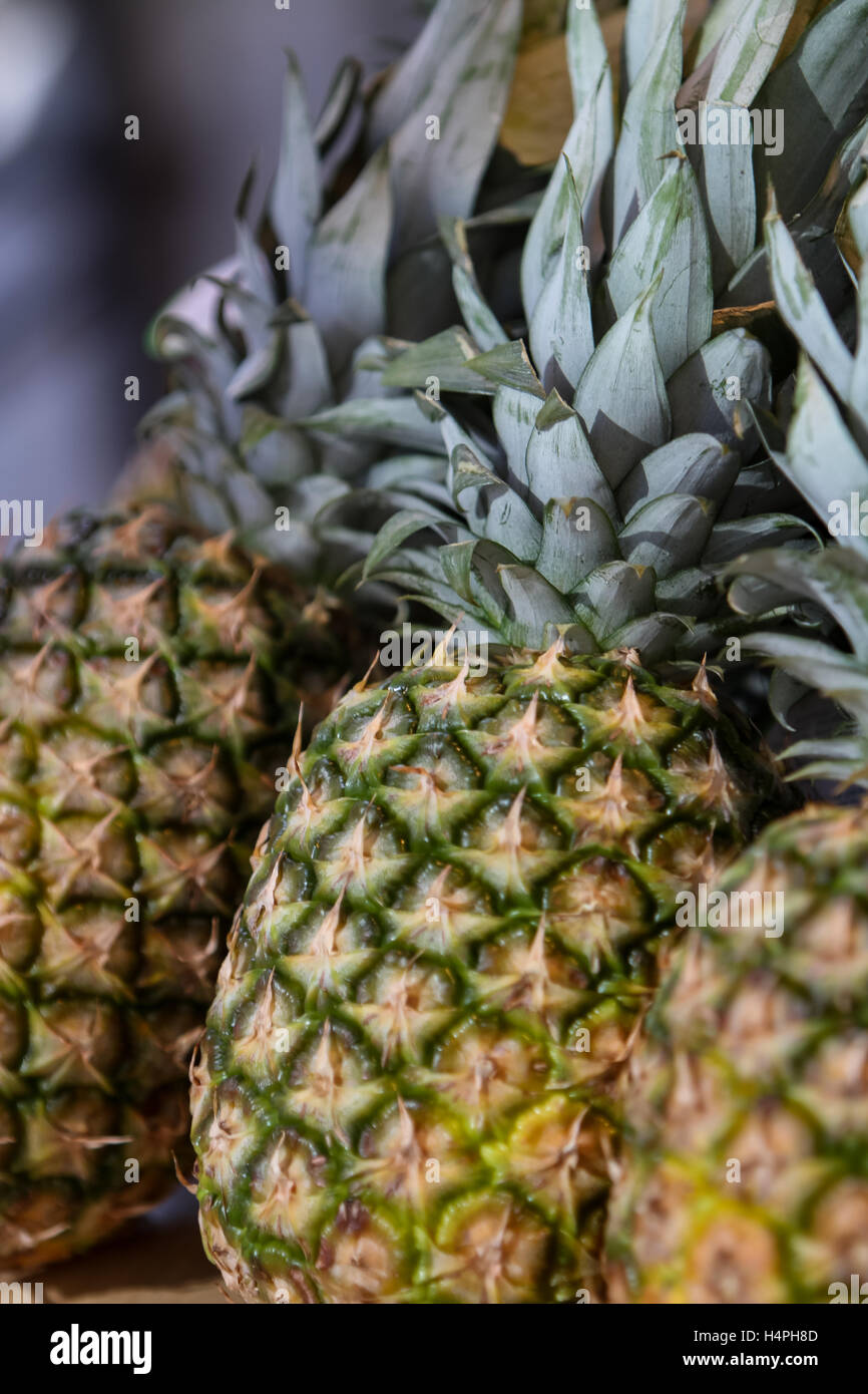 A stack of fresh pineapples for sale at a market Stock Photo Alamy