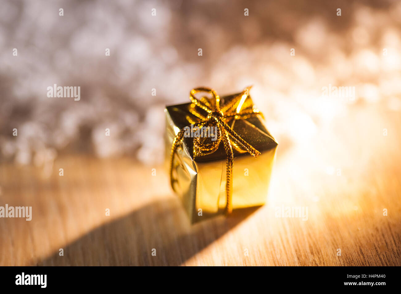 gold box gifts for Christmas multicolor background Stock Photo