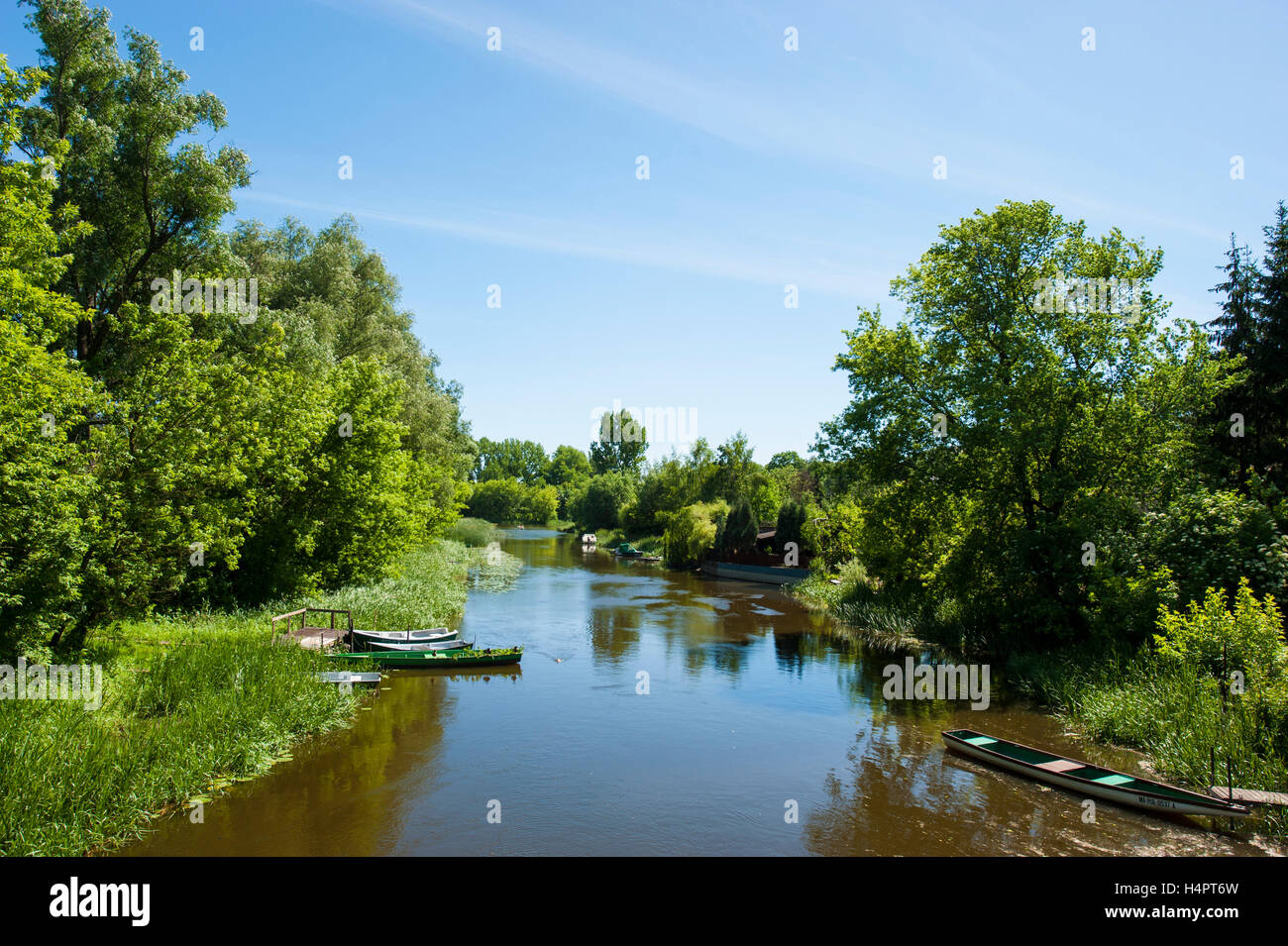 A channel of Narew river flowing through Pultusk, a historical town in Mazovia district of Poland. Stock Photo