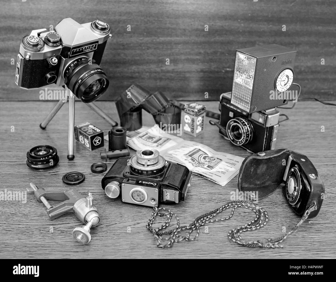 Old photo cameras, flash light, rolls and films Stock Photo - Alamy